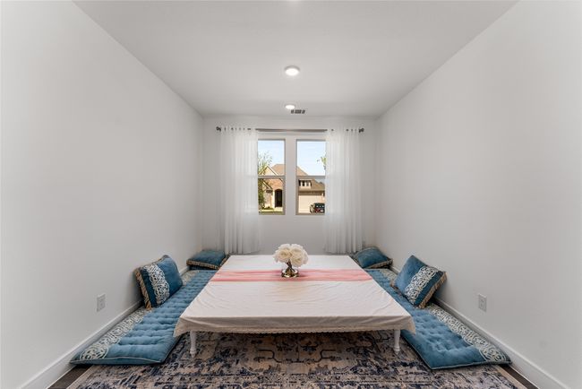 Carpeted bedroom with baseboards and ensuite bathroom | Image 18