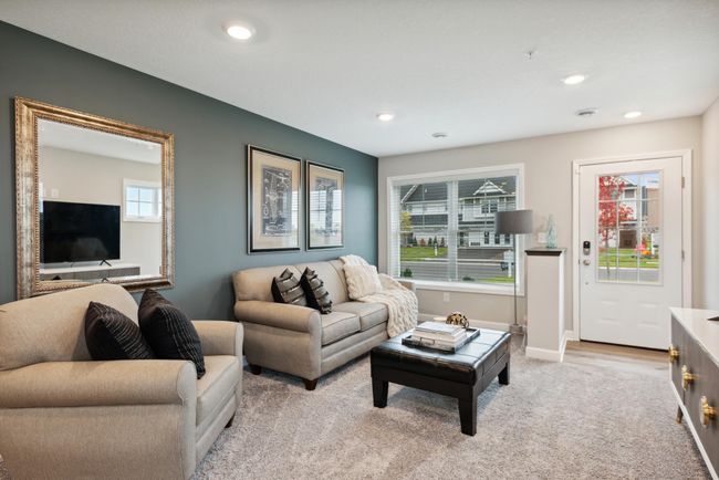 Lovely and inviting great room that features large windows for plenty of natural light. *Photos are of another model, colors and finishes may vary. | Image 8