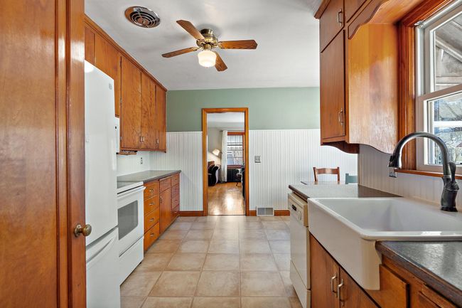 Looking from the kitchen to the living room beyond. | Image 6