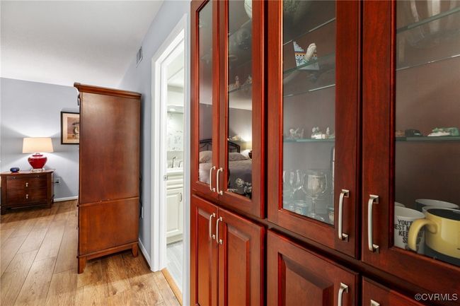 Doorway featuring visible vents, light wood-type flooring, and a sink | Image 19