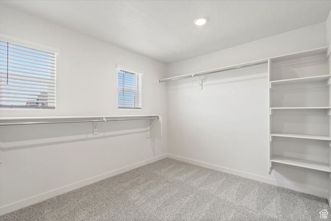 Walk in closet featuring carpet floors | Image 35