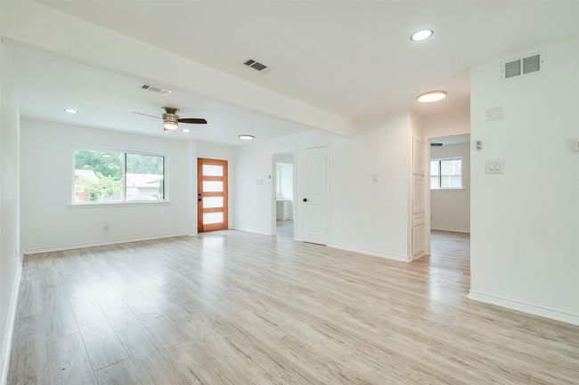 Spare room featuring light wood finished floors, ceiling fan, and recessed lighting | Image 4