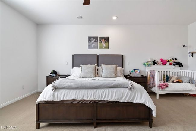 Carpeted bedroom featuring ceiling fan, recessed lighting, and baseboards | Image 25
