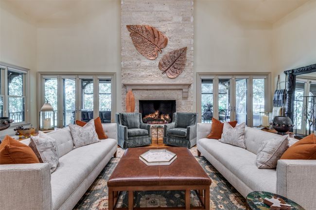 Great Room features a stunning Austin stone fireplace | Image 14