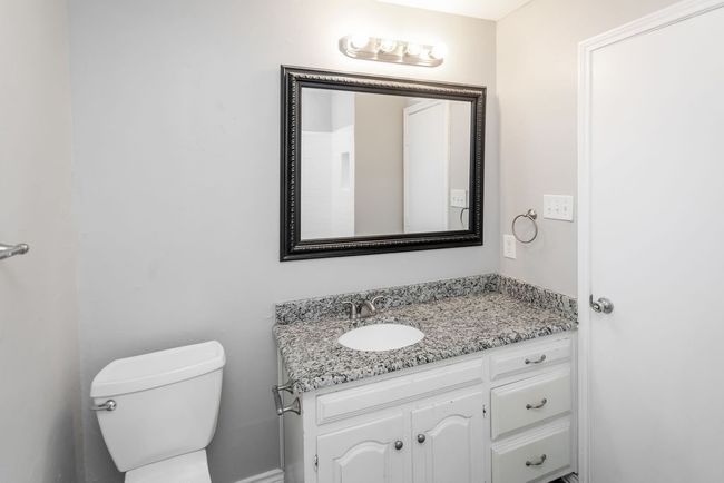 Half bathroom featuring vanity and toilet | Image 20
