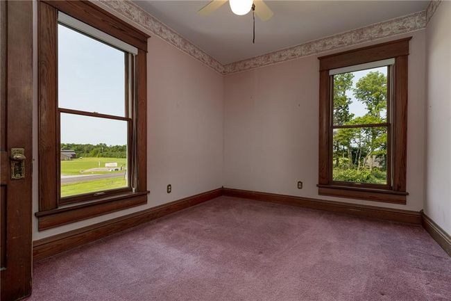 Spare room with carpet flooring, a healthy amount of sunlight, and ceiling fan | Image 29