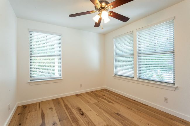Empty room featuring light wood-type flooring and plenty of natural light | Image 19
