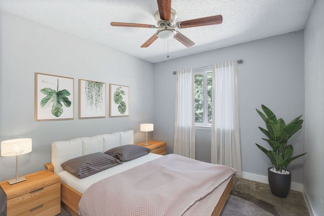 Bedroom with a textured ceiling and ceiling fan | Image 15