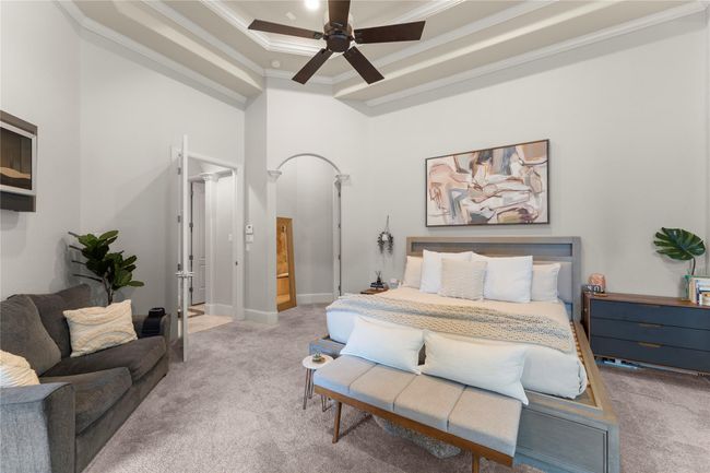 The serene master suite with transitions into a beautifully finished bathroom | Image 27