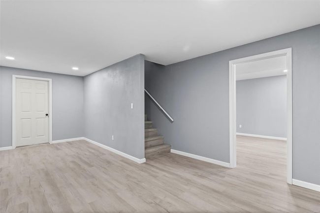 Spare room with baseboards, visible vents, a wealth of natural light, and light wood-style floors | Image 20