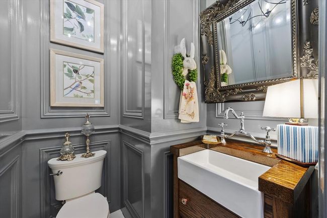 Bathroom featuring toilet and large vanity | Image 24