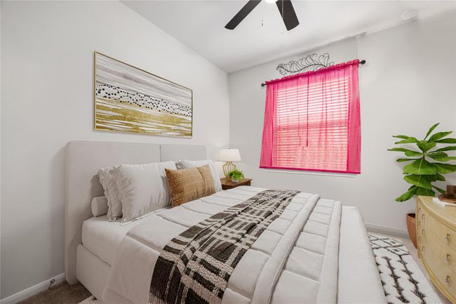 Charming secondary bedroom with neutral tones and ample natural light, perfect for guests, kids, or a home office. *Virtually Staged | Image 18