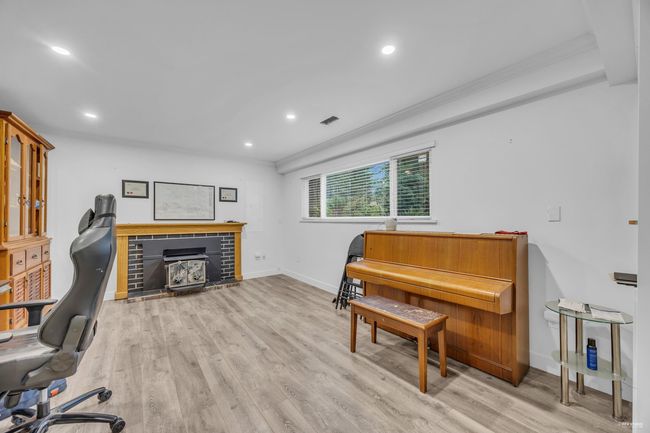Home office featuring crown molding, recessed lighting, and wood finished floors | Image 5