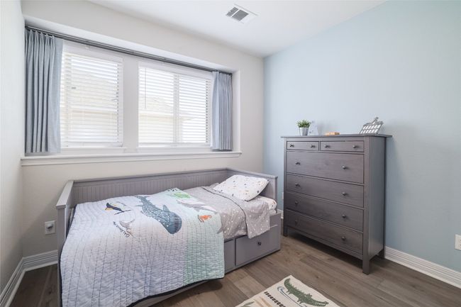 Bedroom with wood finished floors | Image 27