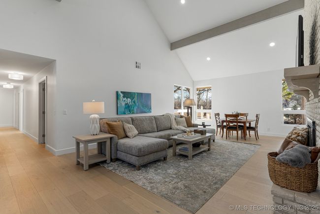 Formal living room with floor-to-ceiling brick fireplace | Image 25