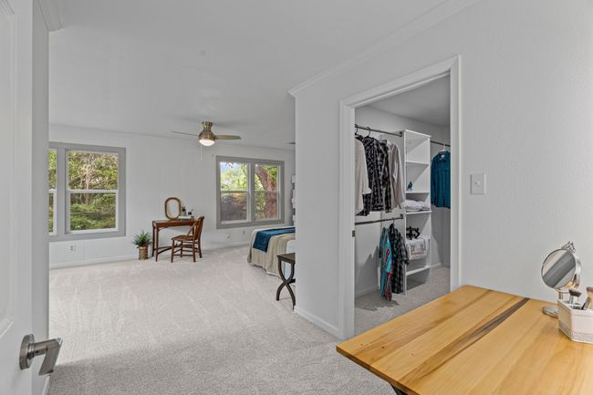 Sitting room featuring carpet floors, a ceiling fan, and ornamental molding | Image 18