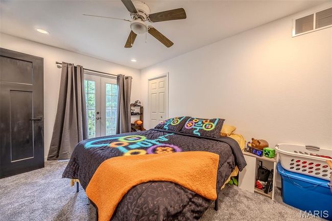 Carpeted bedroom featuring ceiling fan, recessed lighting, and access to outside | Image 39