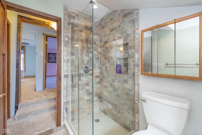 full bath featuring toilet and a shower stall | Image 16