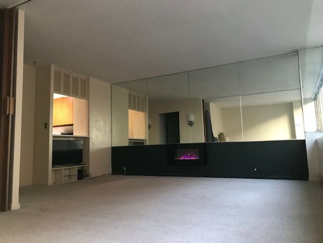 View from bedroom to living room. Note electric fi | Image 4