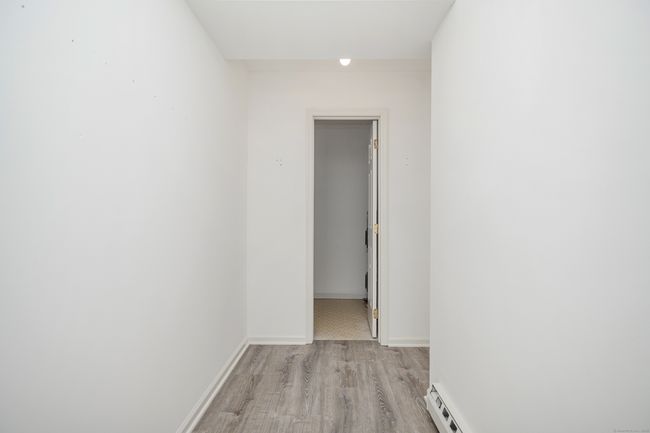 Walk-in Closet with more storge in the back utility room | Image 14