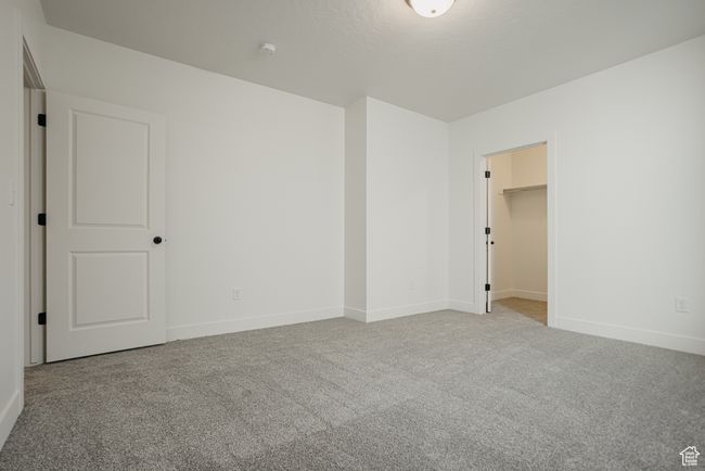 Unfurnished room featuring light carpet | Image 34