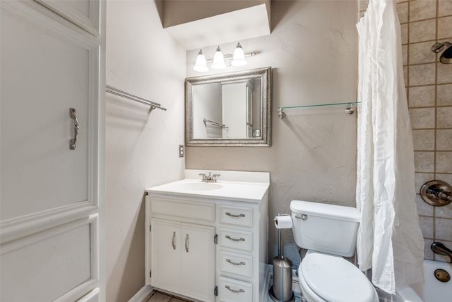 Full bath with vanity, toilet, and shower / tub combo with curtain | Image 12