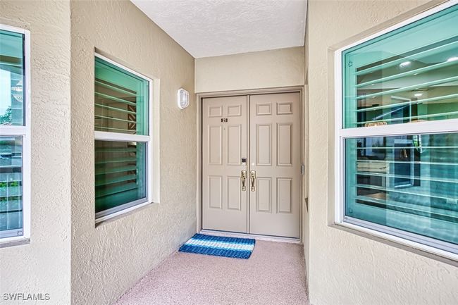 Property entrance featuring stucco siding | Image 9