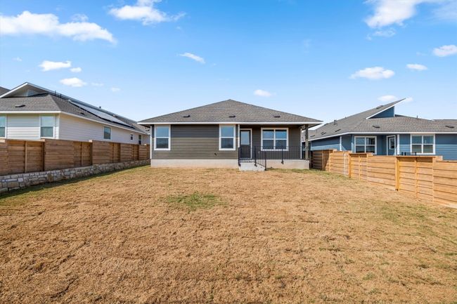 Rear view of house with a fenced backyard | Image 31