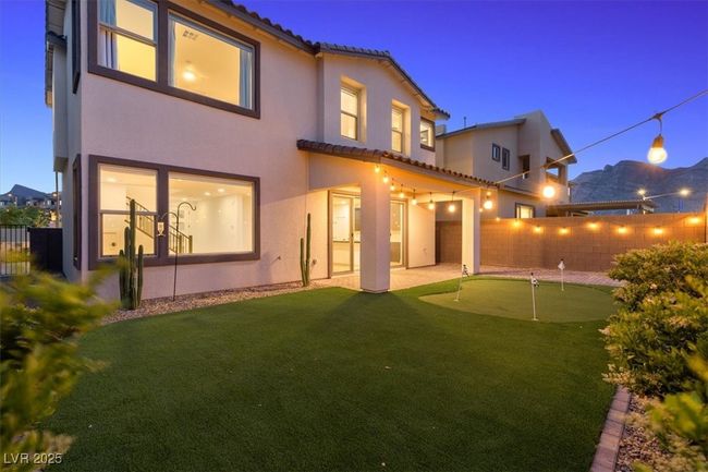 Back of house featuring a tile roof, a patio, stucco siding, and a fenced backyard | Image 55