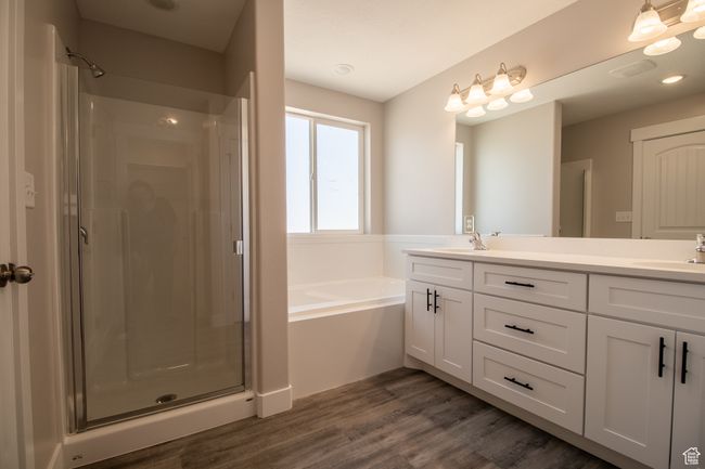 Full bathroom with a shower stall, a garden tub, and a sink. *Photo in picture is similar to the home being built | Image 7