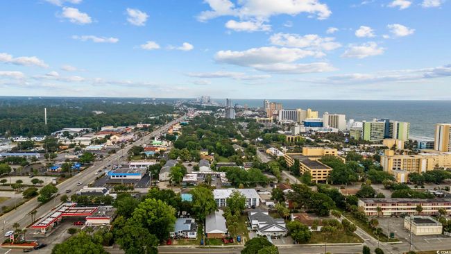 View of urban area featuring a nearby body of water | Image 26