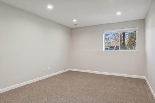 This is bedroom three. This is one of two bedrooms in the lower level. Great recessed lighting, fresh paint, and new carpet. | Image 36