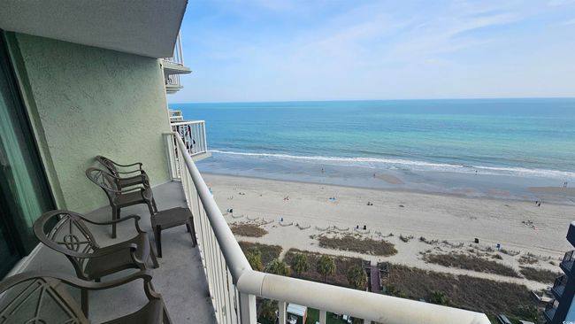 Balcony featuring a water view and a beach view | Image 30