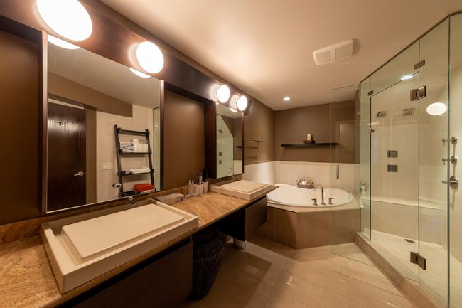 Bathroom with tile patterned flooring, a bath, vanity, visible vents, and a stall shower | Image 23