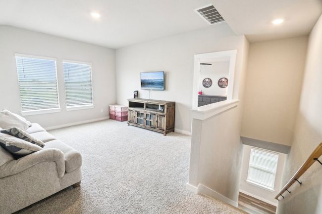 Upstairs you will find a second living space | Image 25