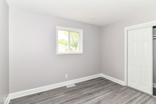 unfurnished room featuring wood finished floors and baseboards | Image 19