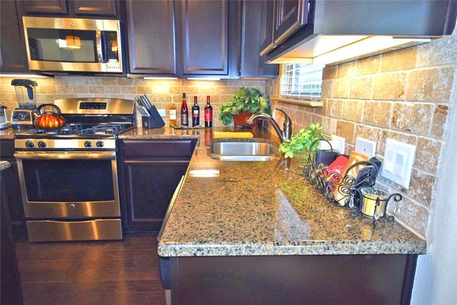 kitchen with window to backyard | Image 11