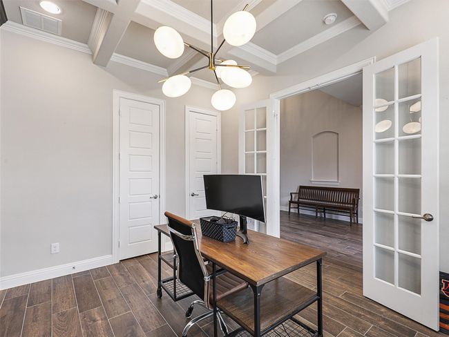 Spacious office with coffered ceiling and artistic lighting | Image 5
