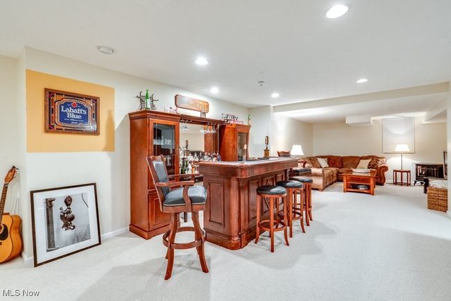 Indoor dry bar featuring light carpet and recessed lighting | Image 34