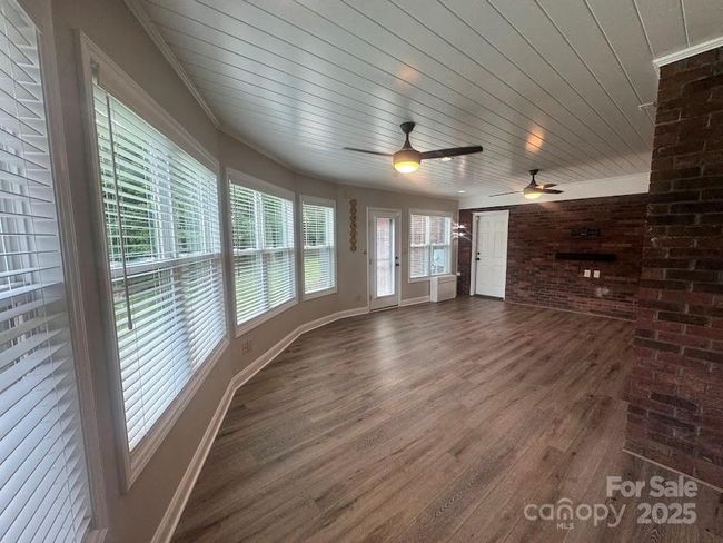TV mount, ceiling fans and so much natural light | Image 30
