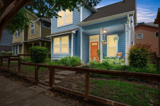View of front of home with a shingled roof and covered porch | Image 29