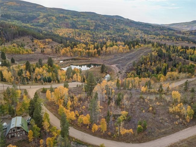 Bird's eye view with a mountain view and a wooded view | Image 6