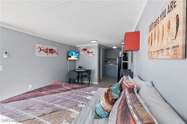 Bedroom with light tile patterned flooring | Image 19