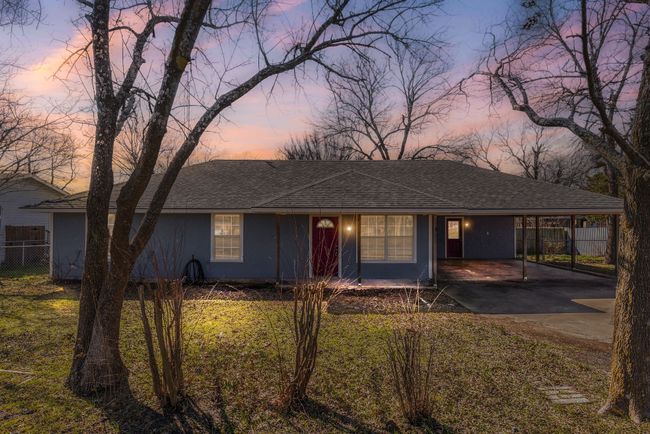Single story home with driveway, a shingled roof, and fence | Image 4