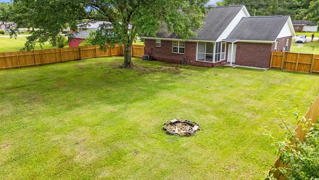 View of fenced backyard | Image 29