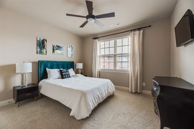 Upstairs Bedroom3 featuring light colored carpet and ceiling fan | Image 19