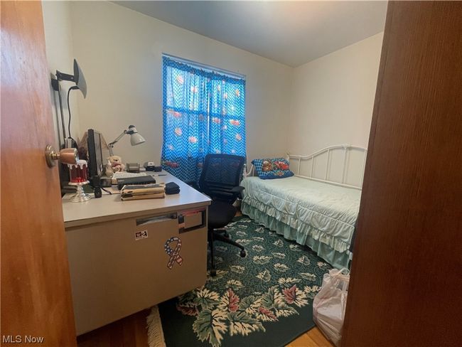 Bedroom with wood-type flooring | Image 26