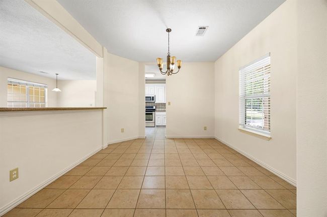 This formal Dining area is perfect for the Holidays. It is open to both the kitchen and the living room so that you and your guests wont have to miss out on anything! | Image 8