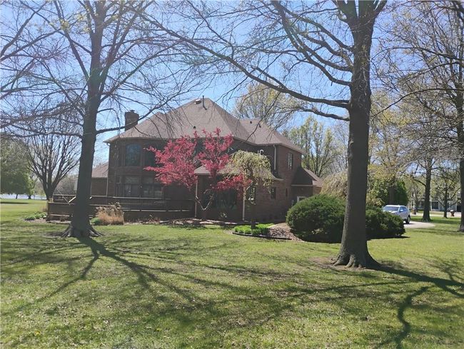 View of side of property with a lawn and a chimney | Image 10