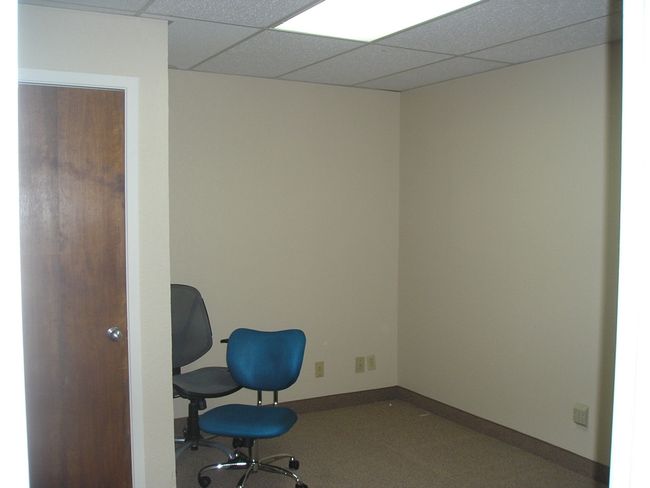 Unfurnished room featuring a drop ceiling and baseboards | Image 12